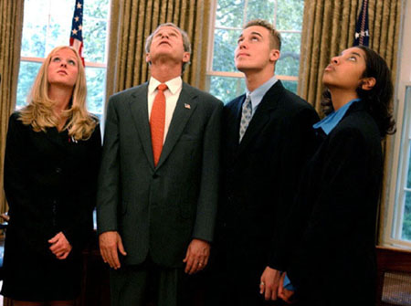 President George W. Bush gives a tour of the Oval Office