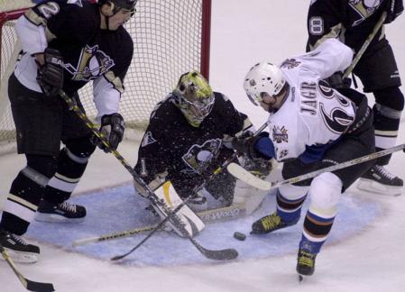 Capitals Jaromir Jagr makes a shot on goal against Penguins goalie Johan Hedberg