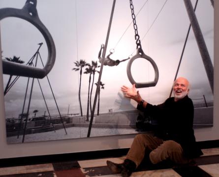 enjoys the moment with one of his photos.
