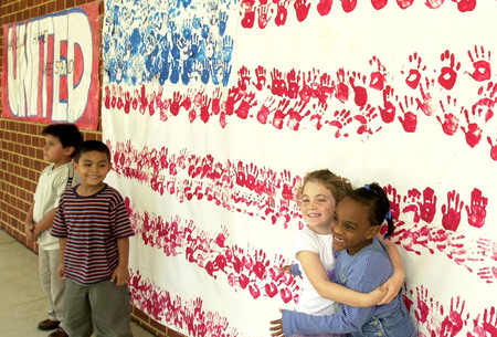 Students at Randolph E.S. celebrate a hand print flag they made following the 9/11 attacks.